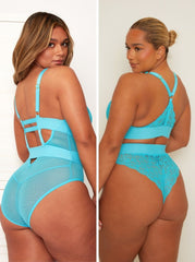Woman wearing a turquoise lace lingerie set from back view.