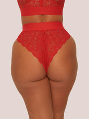 Red lace lingerie set on a plain background