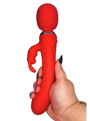 Red silicone toy held by a hand on a white background