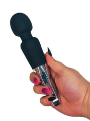 Hand holding a black and silver massage tool against a white background